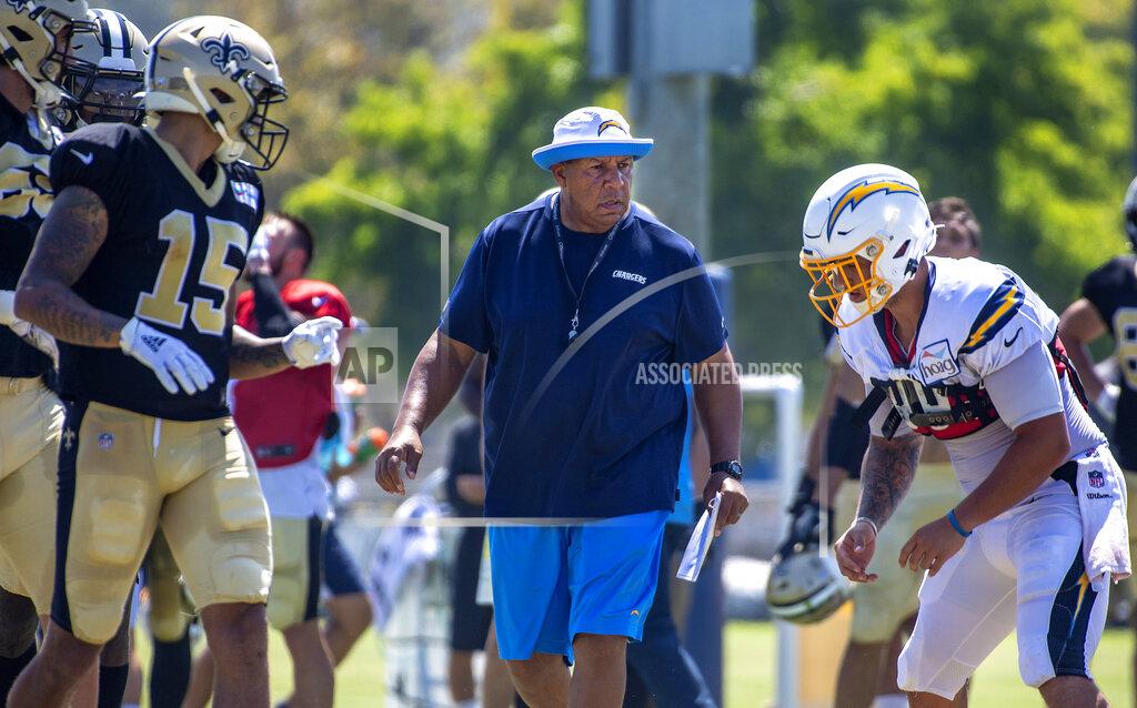 FILE - In this Thursday, Aug. 15, 2019 file photo, Los Angeles Chargers special teams coach George Stewart watches players during the NFL football team's joint practice with the New Orleans Saints in Costa Mesa, Calif. The Los Angeles Chargers have demoted special teams coordinator George Stewart, Wednesday, Nov. 25, 2020. The move comes after a series of breakdowns on special teams nearly cost the Chargers (3-7) against the New York Jets on Sunday. (Mark Rightmire/The Orange County Register via AP, File)