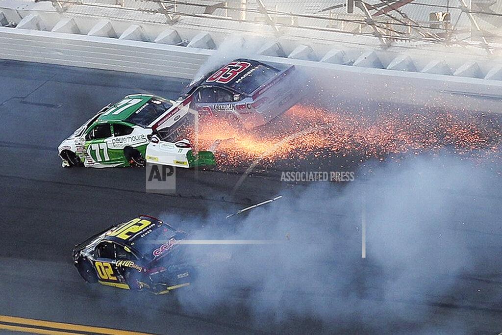 David Graham Jacob Heafner (77), Dave Mader III (63) and Andy Seuss (02) wreck in Turn 1 during the ARCA series auto race at Daytona International Speedway, Saturday, Feb. 8, 2020, in Daytona Beach, Fla. (AP Photo/David Graham)