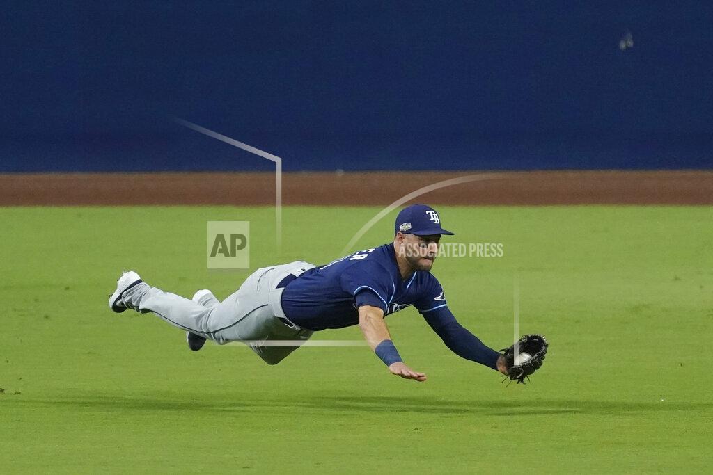Ashley Landis Tampa Bay Rays center fielder Kevin Kiermaier makes a leaping catch on a fly ball by Houston Astros Carlos Correa during the third inning in Game 3 of a baseball American League Championship Series, Tuesday, Oct. 13, 2020, in San Diego. (AP Photo/Ashley Landis)