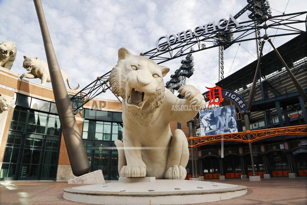 Carlos Osorio FILE - This Monday, Feb. 3, 2020, file photo shows the exterior of Comerica Park, home of the Detroit Tigers, in Detroit. The Tigers will play soon at Comerica Park, one of three sporting venues clustered within a mile of each other in the Motor City. With professional teams from four major leagues playing so close to each other, downtown Detroit is unique. And, that makes the COVID-19 pandemic hit a little harder here. For businesses in the area it has lately been a bust for those banking on a revenue stream from fans. (AP Photo/Carlos Osorio, File)