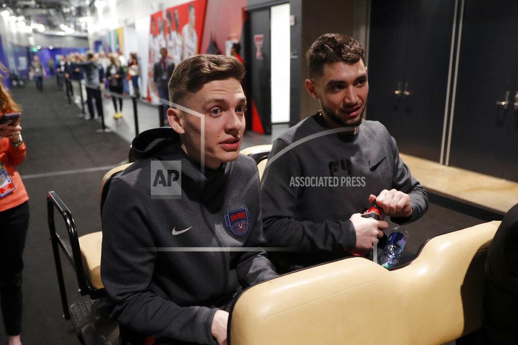 Charlie Neibergall Virginia's Kyle Guy, left, and Ty Jerome arrive at a news conference for the championship of the Final Four NCAA college basketball tournament, Sunday, April 7, 2019, in Minneapolis. Virginia will play Texas Tech on Monday for the national championship. (AP Photo/Charlie Neibergall)