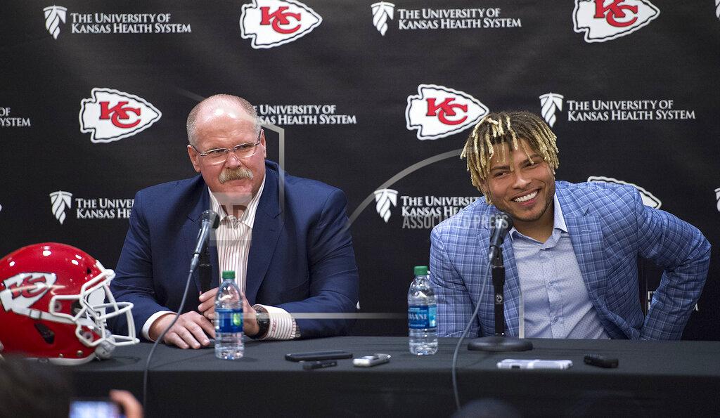 Tammy Ljungblad Kansas City Chiefs head coach Andy Reid, left, listens as safety Tyrann Mathieu speaks during an NFL football news conference Thursday, March 14, 2019, at the team's practice facility in Kansas City, Mo. (Tammy Ljungblad/The Kansas City Star via AP)