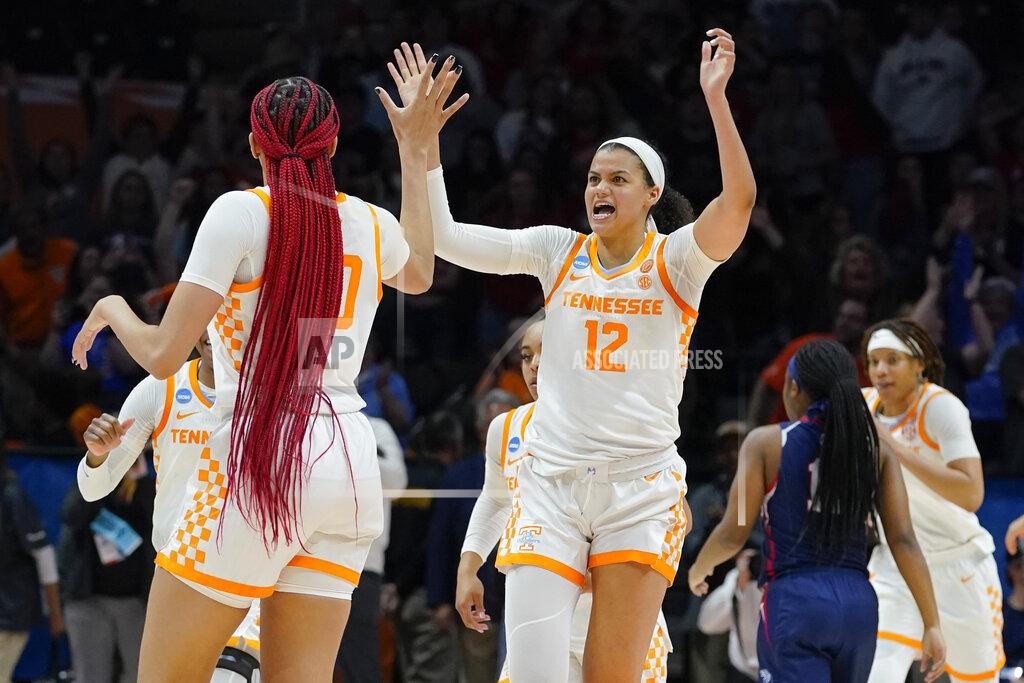 Mark Humphrey Tennessee's Rae Burrell (12) celebrates with Tamari Key (20) after Tennessee beat Belmont 70-67 in a women's college basketball game in the second round of the NCAA tournament Monday, March 21, 2022, in Knoxville, Tenn. (AP Photo/Mark Humphrey)