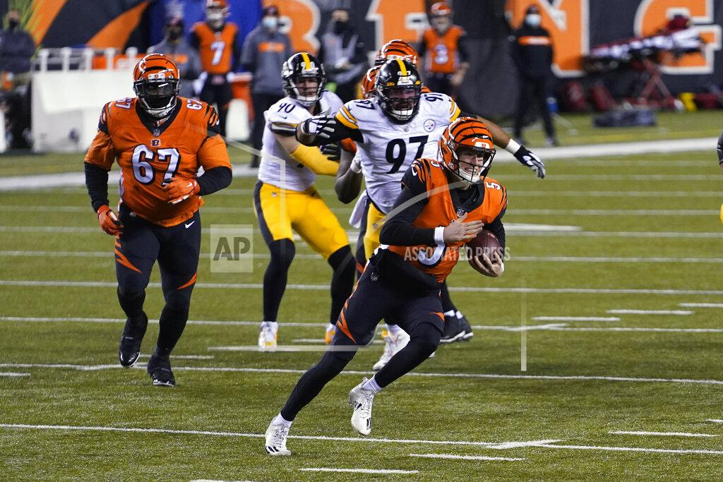 Bryan Woolston Cincinnati Bengals quarterback Ryan Finley (5) scrambles during the first half of an NFL football game against the Pittsburgh Steelers, Monday, Dec. 21, 2020, in Cincinnati. (AP Photo/Bryan Woolston)