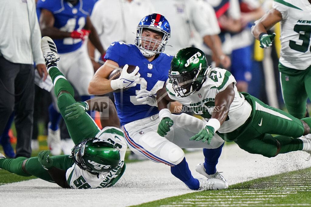 Corey Sipkin New York Giants running back Sandro Platzgummer (34) is knocked out of bounds on a run against New York Jets defensive back Corey Ballentine (27) in the second half of an NFL preseason football game, Saturday, Aug. 14, 2021, in East Rutherford, N.J. (AP Photo/Corey Sipkin)