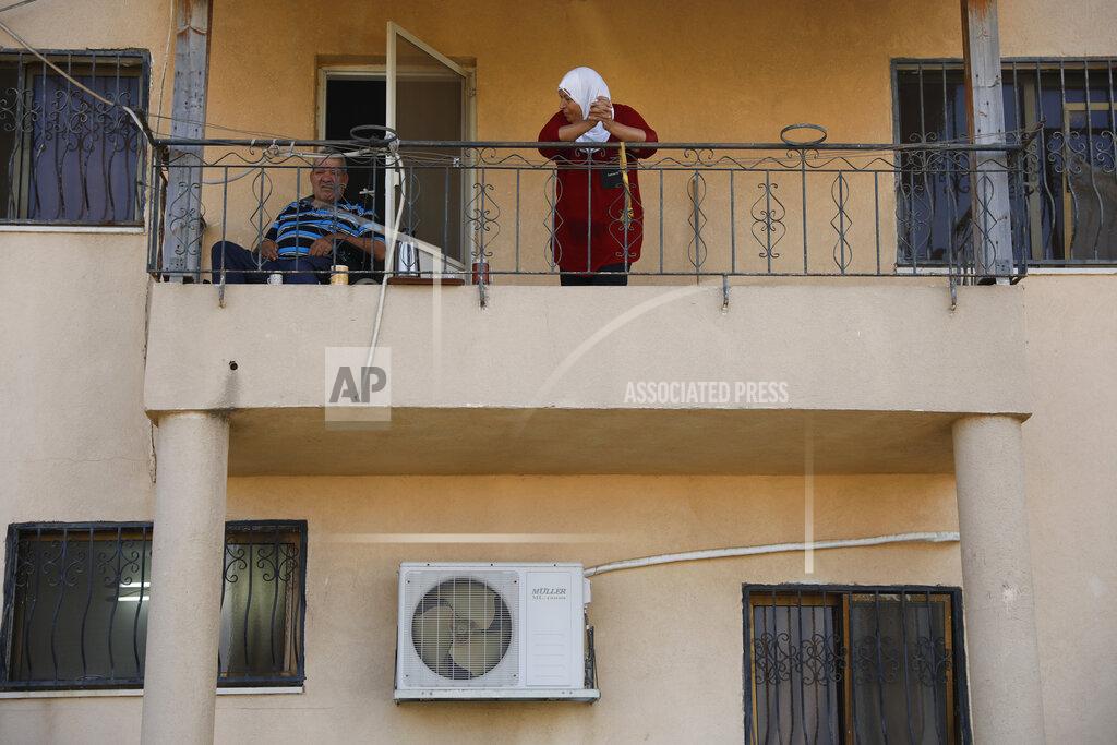 Ariel Schalit Locals look at Palestinian fugitive Zakaria Zubeidi's hideouts in Umm al-Ghanam, northern Israel, Saturday, Sept. 11, 2021. Following Zubeidi's arrest, police said they have caught four of six Palestinians who broke out of a maximum-security prison early this week. (AP Photo/Ariel Schalit)