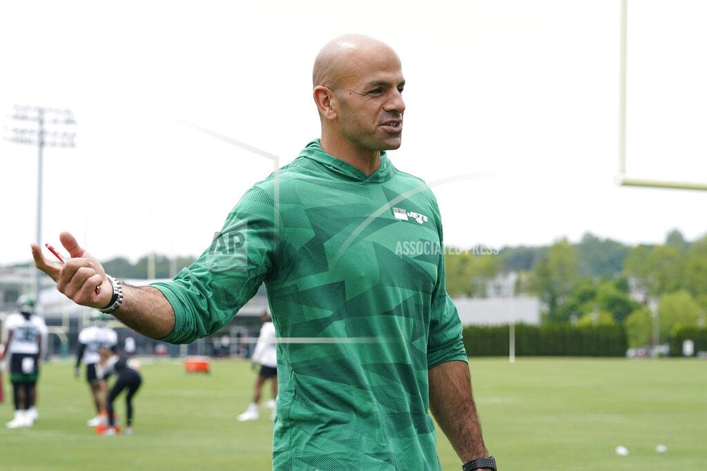 New York Jets head coach Robert Saleh gestures as he speaks informally to a group of journalists in the end zone during an NFL football practice, Wednesday, June 2, 2021, in Florham Park, N.J. (AP Photo/Kathy Willens)