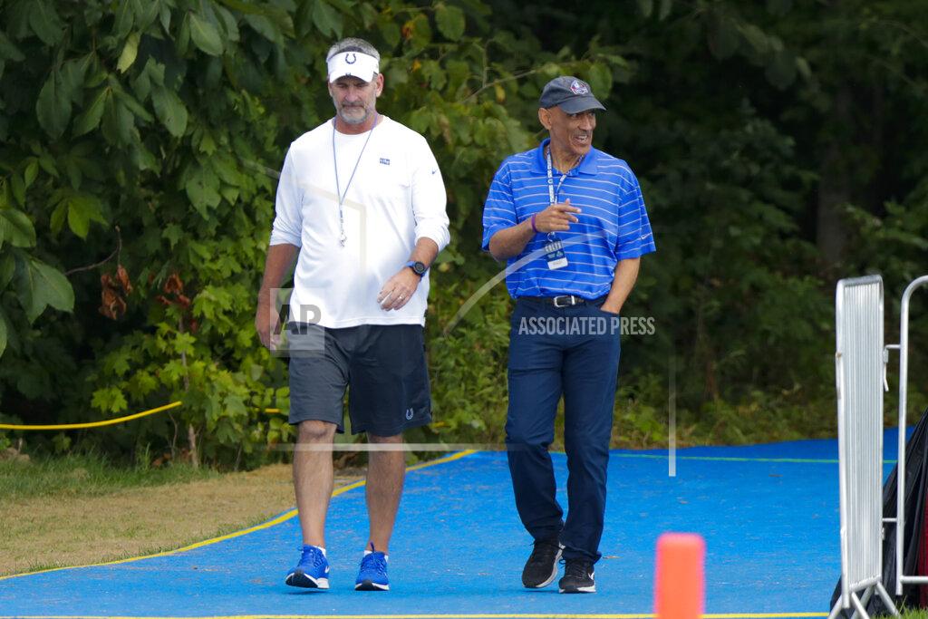 Michael Conroy Indianapolis Colts head coach Frank Reich walks to the field with former Colts coach Tony Dungy practice at the NFL team's football training camp in Westfield, Ind., Thursday, Aug. 15, 2019. The Colts held a joint practice with the Cleveland Browns. (AP Photo/Michael Conroy)