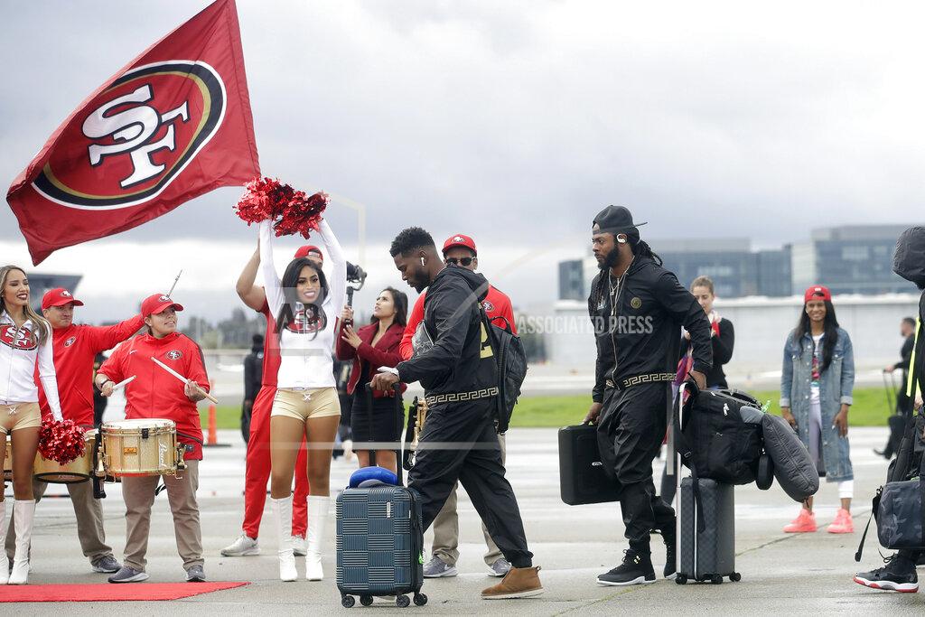 Jeff Chiu San Francisco 49ers free safety Jimmie Ward, center left, and cornerback Richard Sherman board a plane as the team departs from Mineta San Jose International Airport in San Jose, Calif., for Miami, Sunday, Jan. 26, 2020. The 49ers will face the Kansas City Chiefs in Super Bowl 54. (AP Photo/Jeff Chiu)