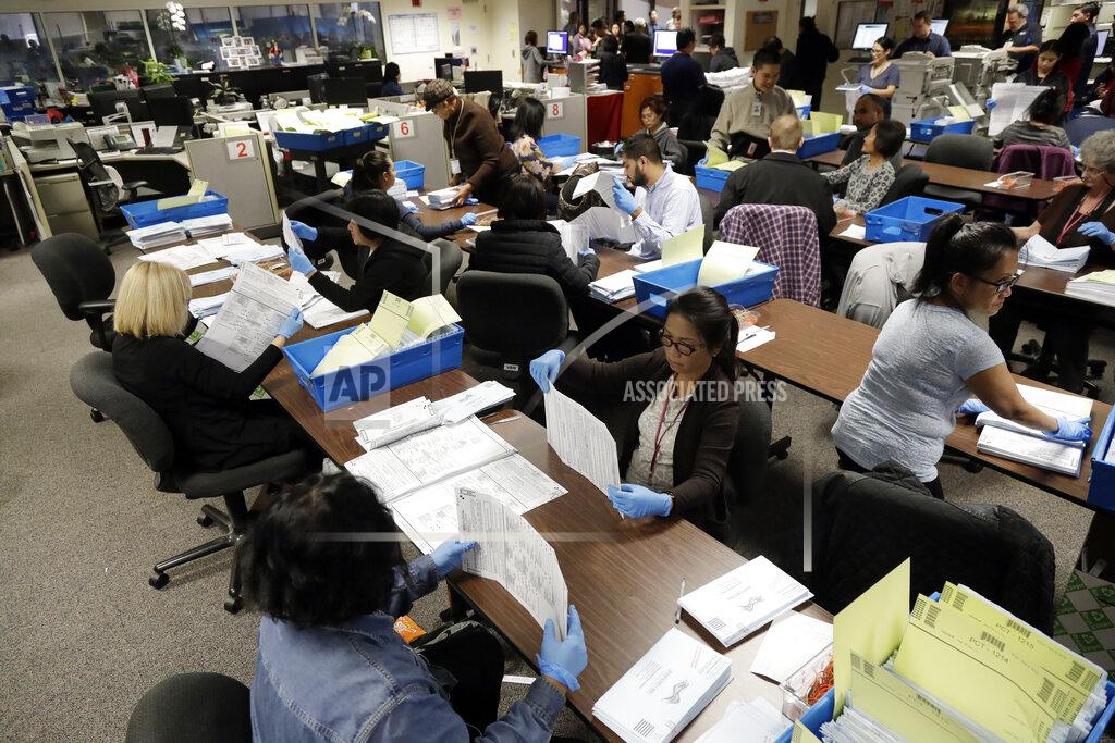 Marcio Jose Sanchez FILE - This Nov. 4, 2016, file photo shows mail-in ballots being sorted at the Santa Clara County Registrar of Voters in San Jose, Calif. Over 100,000 mail-in ballots were rejected by election officials in California's March 2020 presidential primary, highlighting a glaring gap in the effort to ensure every vote is counted as a national dispute rages over the integrity of vote-by-mail elections. (AP Photo/Marcio Jose Sanchez, File)