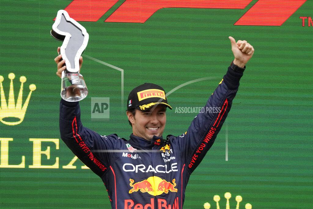 Luca Bruno Red Bull driver Sergio Perez of Mexico celebrates on the podium his second place at the Emilia Romagna Formula One Grand Prix, at the Enzo and Dino Ferrari racetrack, in Imola, Italy, Sunday, April 24, 2022. (AP Photo/Luca Bruno)