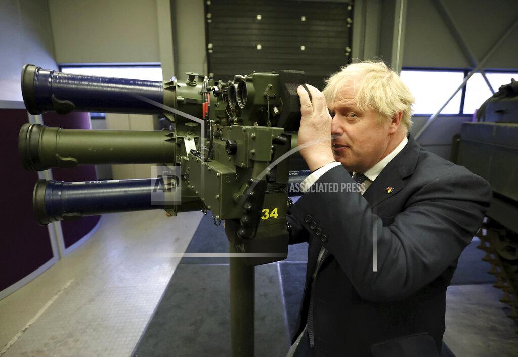 Liam Mcburney Britain's Prime Minister Boris Johnson with a Mark 3 shoulder launch LML (Lightweight Multiple Launcher) missile system, at Thales weapons manufacturer in Belfast, Monday May 16, 2022, during a visit to Northern Ireland. Johnson said there would be “a necessity to act” if the EU doesn't agree to overhaul post-Brexit trade rules that he says are destabilizing Northern Ireland's delicate political balance. Johnson held private talks with the leaders of Northern Ireland's main political parties, urging them to get back to work. (Liam McBurney/Pool via AP)
