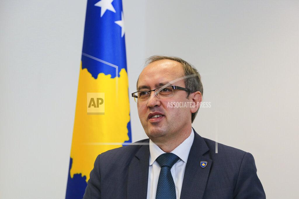 Visar Kryeziu Avdullah Hoti (L), candidate for prime minister of the Democratic League of Kosovo (LDK), during an interview with The Associated Press, in capital Pristina, Kosovo, photo taken on Monday, Feb. 1, 2021. Kosovo holds an early general election Sunday in which contenders face the same old and new challenges: post-pandemic economic recovery and dialogue over normalizing ties with Serbia. The Feb. 14 election was scheduled after Kosovo's Constitutional Court rendered invalid a vote by a sentenced lawmaker who helped confirm a Cabinet named in June after then-Prime Minister Albin Kurti was removed in a fragile governing coalition.(AP Photo/Visar Kryeziu)
