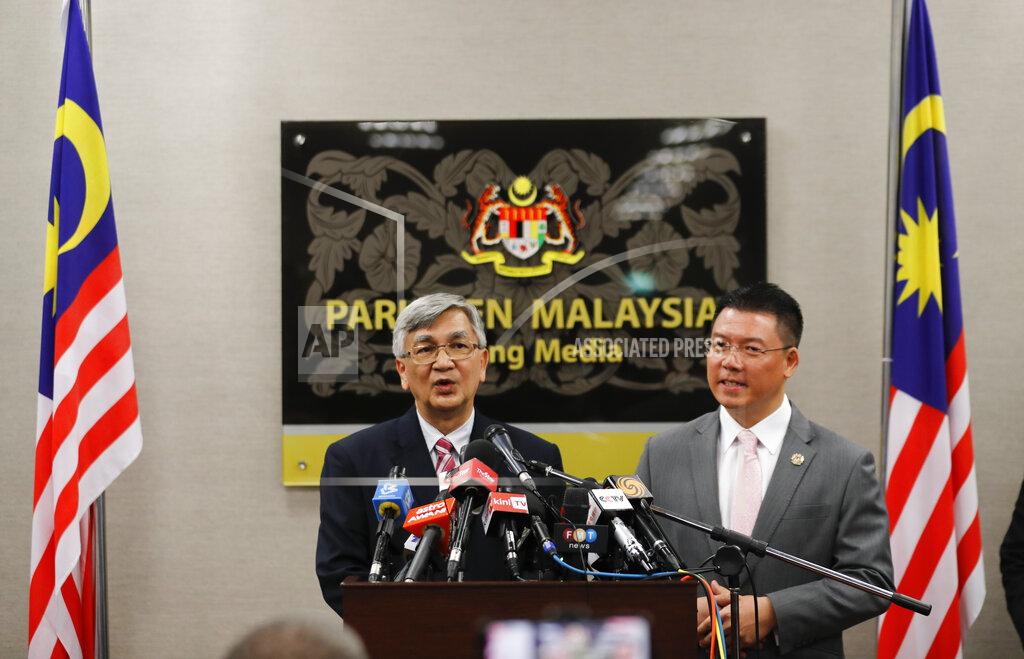 Vincent Thian Malaysia parliament lower house speaker Mohamad Ariff Md Yusof, left, and deputy speaker Nga Kor Ming speaks to media after a vote on motions to appoint a new speaker during a parliament session in Kuala Lumpur, Malaysia, Monday, July 13, 2020. Malaysian new Prime Minister Muhyiddin Yassin narrowly won a motion to boot the parliament speaker Monday, scraping through the first test of his support nearly five months after he took power. (AP Photo/Vincent Thian)