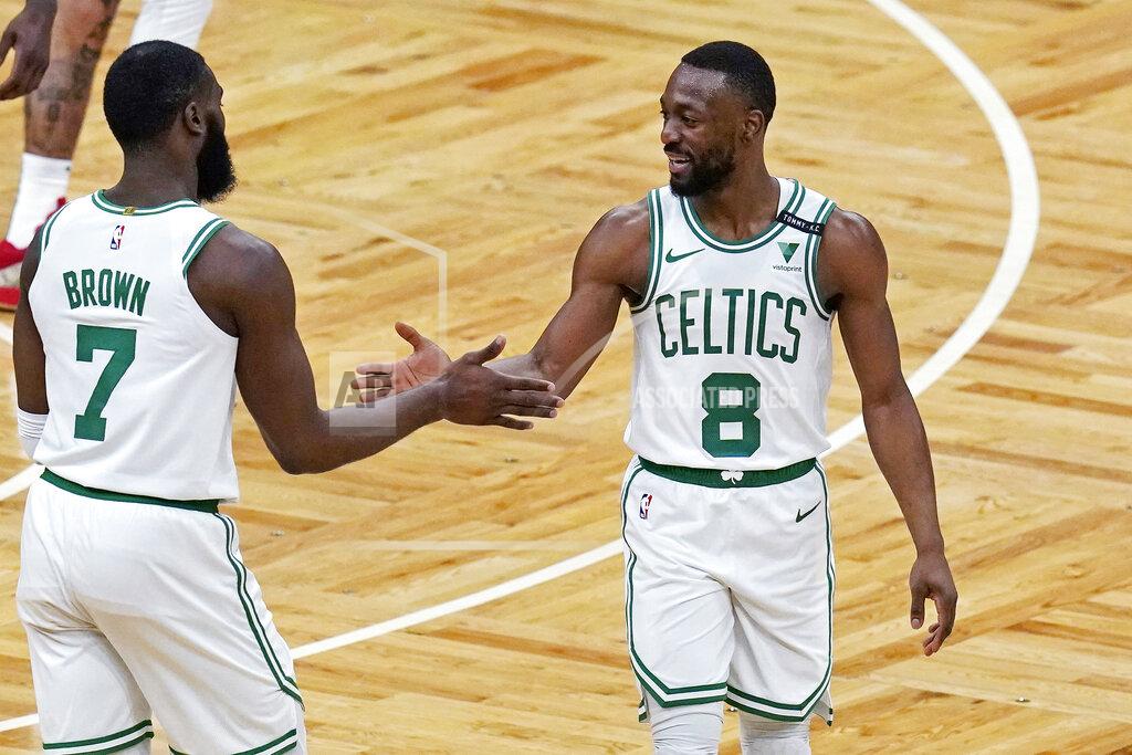 Charles Krupa Boston Celtics guard Kemba Walker (8) is congratulated by Jaylen Brown after a basket against the Denver Nuggets during the first half of an NBA basketball game Tuesday, Feb. 16, 2021, in Boston. (AP Photo/Charles Krupa)