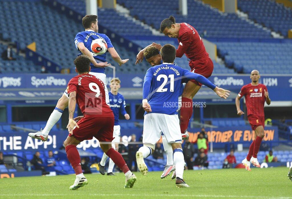 Peter Powell Liverpool's Virgil van Dijk, top right, gets in a header during the English Premier League soccer match between Everton and Liverpool at Goodison Park in Liverpool, England, Sunday, June 21, 2020. (Peter Powell/Pool via AP)