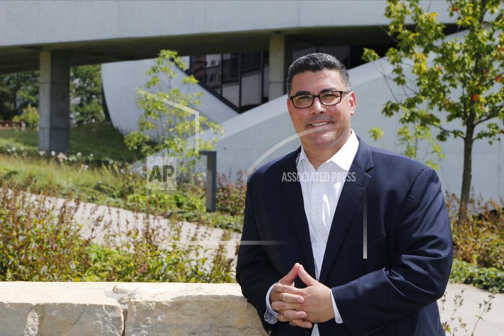 Jay Laprete In this photo made on July 31, 2020, Jason Dominguez poses for a photo at the National Veterans Memorial and Museum, in Columbus, Ohio. Dominguez was a Marine that was in the Columbus, Ohio-based Lima Company that served in Iraq, when the vehicle immediately behind his in a convoy was blown up by a roadside bomb Aug. 3, 2005, killing 15. Some survivors and families of those killed had planned a 15-year reunion this weekend, but it had to be canceled amid restrictions for the COVID-19 pandemic. (AP Photo/Jay LaPrete)