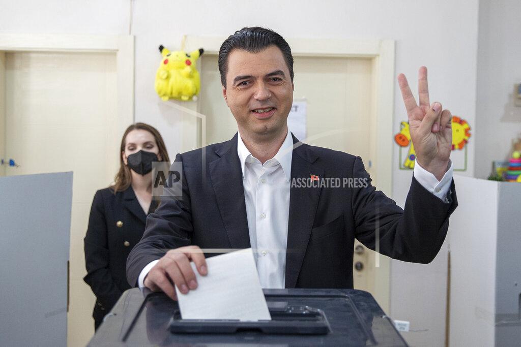 Visar Kryeziu Albanian leader of the opposition Lulzim Basha flashes victory sign as he casts his ballot during parliamentary elections in capital Tirana, Albania on Sunday, April 25, 2021. Albanian voters have started casting ballots in parliamentary elections on Sunday amid the virus pandemic and a bitter political rivalry between the country's two largest political parties. (AP Photo/Visar Kryeziu)