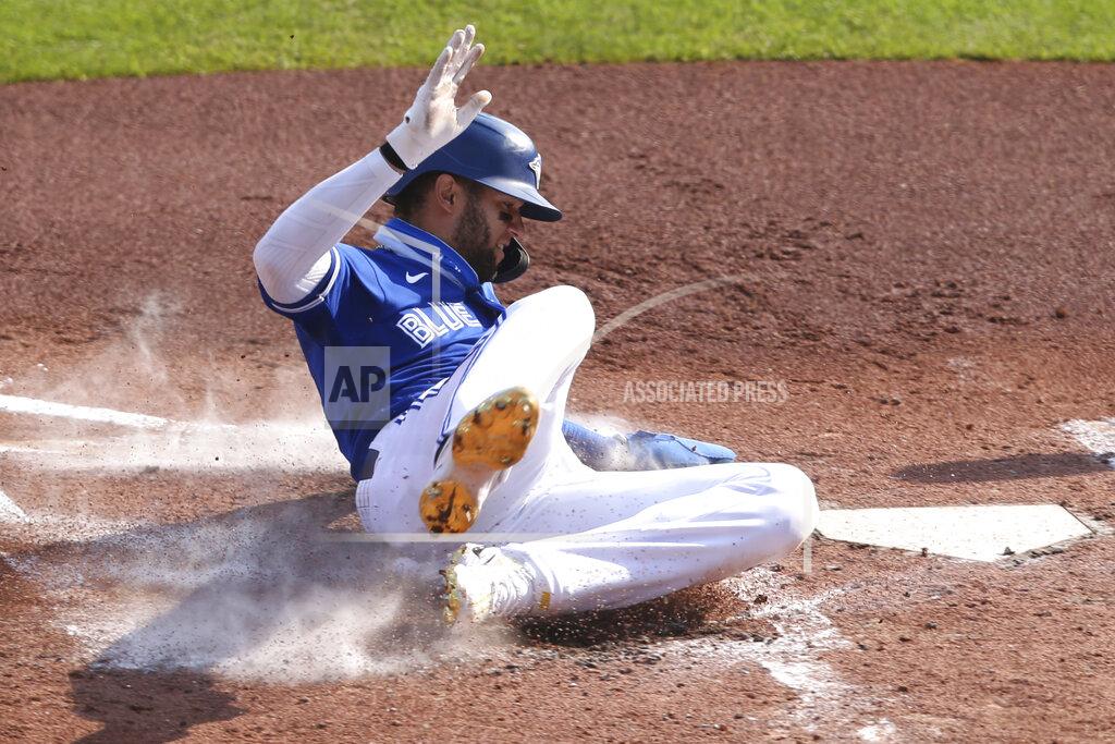 Toronto Blue Jays' Lourdes Gurriel Jr. scores on a sacrifice fly by Jonathan Davis during the second inning of a baseball game against the Baltimore Orioles, Sunday, Sept. 27, 2020, in Buffalo, N.Y. (AP Photo/Jeffrey T. Barnes)