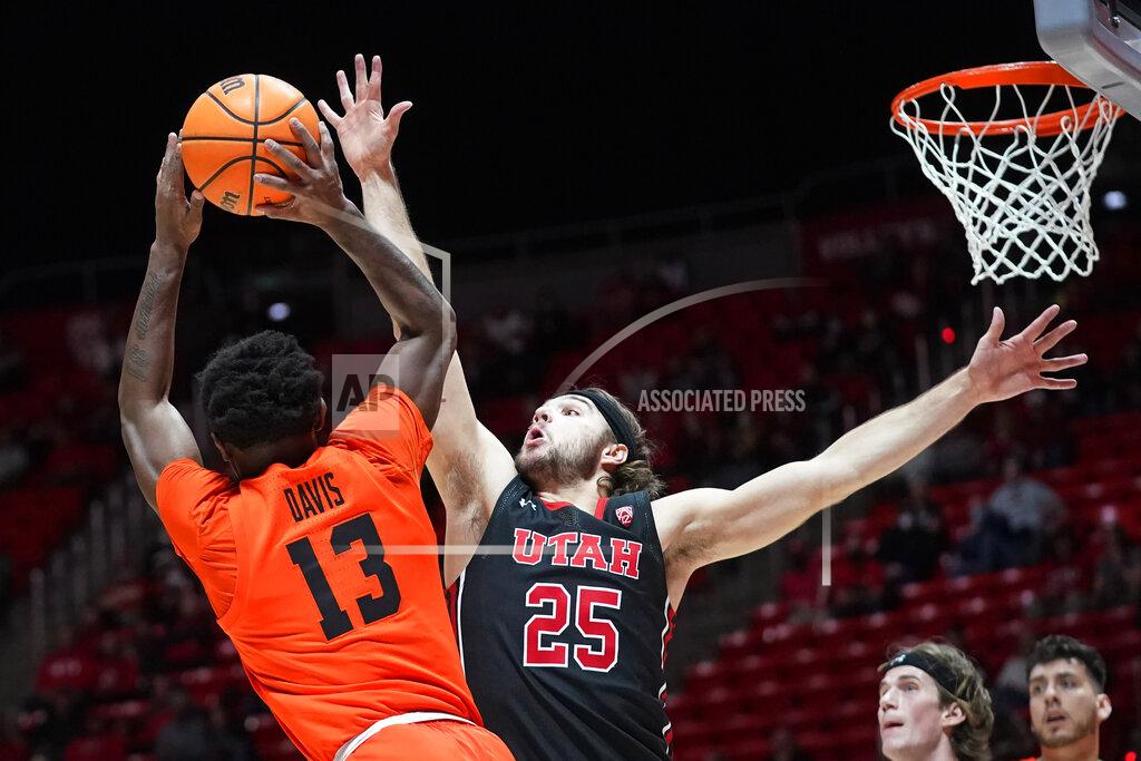 Rick Bowmer Utah guard Rollie Worster (25) defends against Oregon State guard Dashawn Davis (13) in the first half during an NCAA college basketball game Thursday, Feb. 3, 2022, in Salt Lake City. (AP Photo/Rick Bowmer)