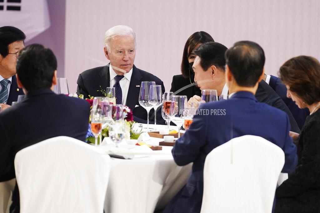 Evan Vucci U.S. President Joe Biden, back left, shares a light moment with South Korean President Yoon Suk Yeol at a state dinner at the National Museum of Korea, Saturday, May 21, 2022, in Seoul. (AP Photo/Evan Vucci)