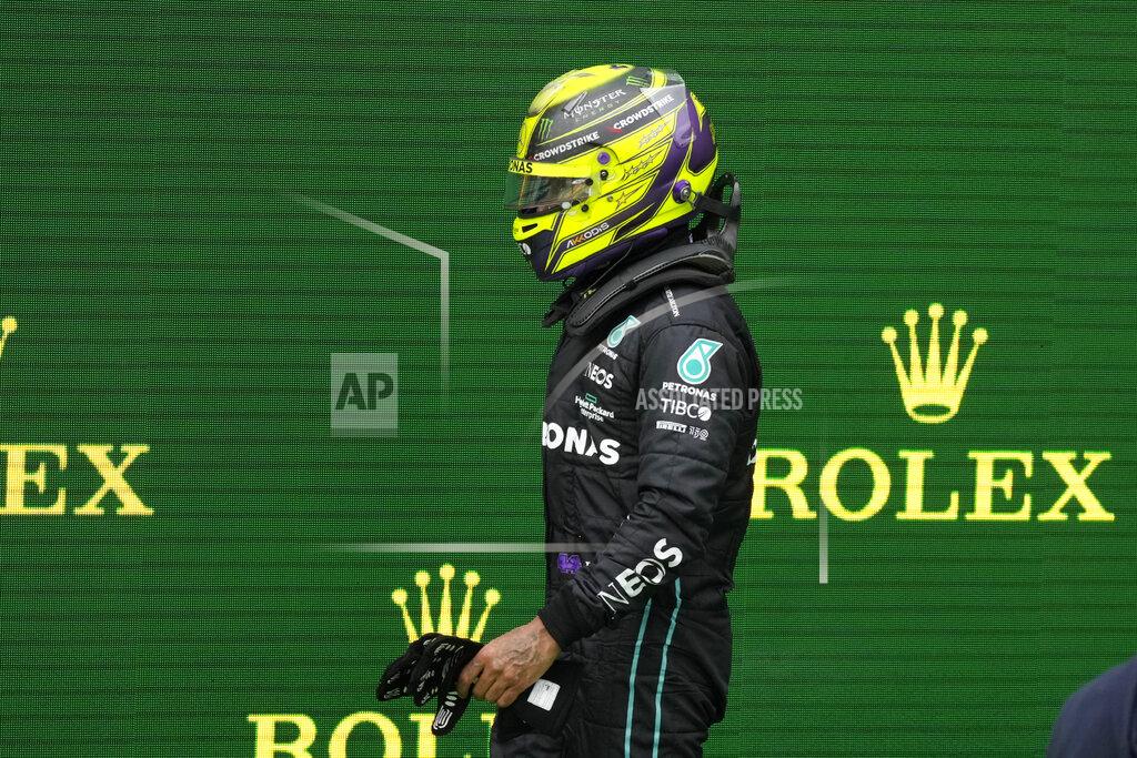 Luca Bruno Mercedes driver Lewis Hamilton of Britain walks at the end of the Emilia Romagna Formula One Grand Prix, at the Enzo and Dino Ferrari racetrack, in Imola, Italy, Sunday, April 24, 2022. (AP Photo/Luca Bruno)
