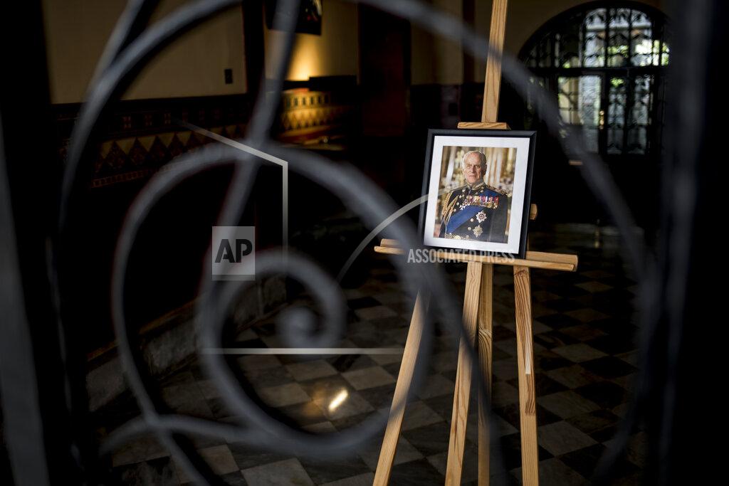 Javier Fergo A portrait of Prince Phillip on display at Governor's house, in Gibraltar, Saturday April 10, 2021. Britain's Prince Philip, the irascible and tough-minded husband of Queen Elizabeth II who spent more than seven decades supporting his wife in a role that mostly defined his life, died on Friday. (AP Photo/Javier Fergo)