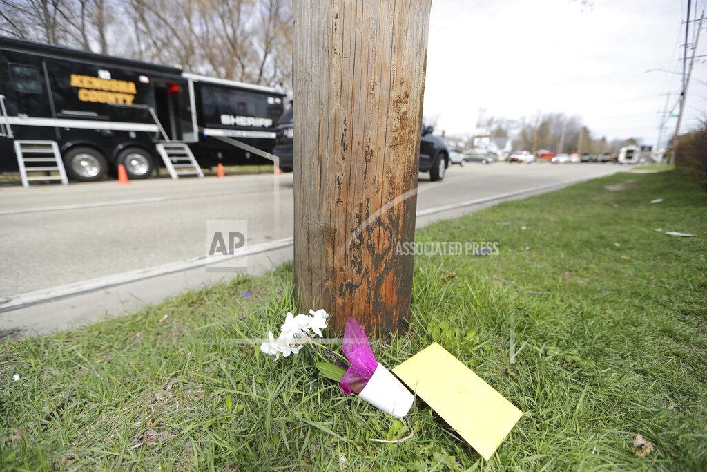 Mike De Sisti Flowers and a card are left near the scene of an early Sunday fatal shooting at Somers House Tavern in Kenosha, Wis., on Sunday, April 18 2021. (Mike De Sisti/Milwaukee Journal-Sentinel via AP)