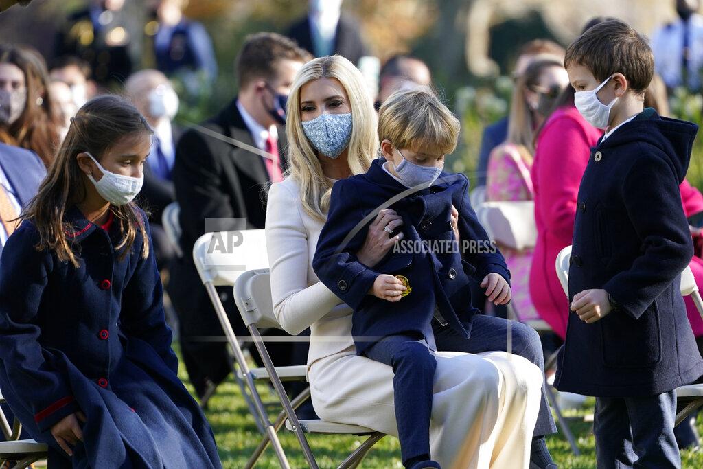 Susan Walsh Ivanka Trump, Assistant to the President, sits with her son Theodore Kushner, center, daughter Arabella Kushner, left, and son Joseph Kushner, right, as they wait for President Donald Trump to pardon Corn, the national Thanksgiving turkey, in the Rose Garden of the White House, Tuesday, Nov. 24, 2020, in Washington. (AP Photo/Susan Walsh)