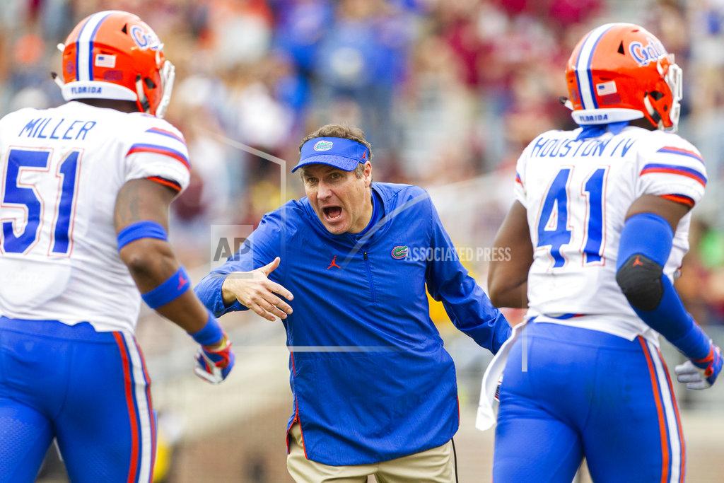 Mark Wallheiser Florida Gators head coach Dan Mullen rushes his team off the field in the 2nd half of an NCAA college football game against Florida State in Tallahassee, Fla., Saturday, Nov. 24, 2018. Florida defeated Florida State 41-14. (AP Photo/Mark Wallheiser)