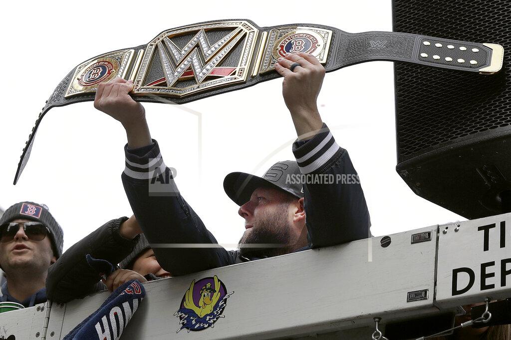 Charles Krupa FILE - In this Oct. 31, 2018, file photo, Boston Red Sox's Dustin Pedroia holds a championship belt during a parade to celebrate the team's World Series championship over the Los Angeles Dodgers in Boston. Pedroia, who was the 2007 Rookie of the Year and the AL MVP in his second season, retired Monday, Feb. 1, 2021. (AP Photo/Charles Krupa, File)