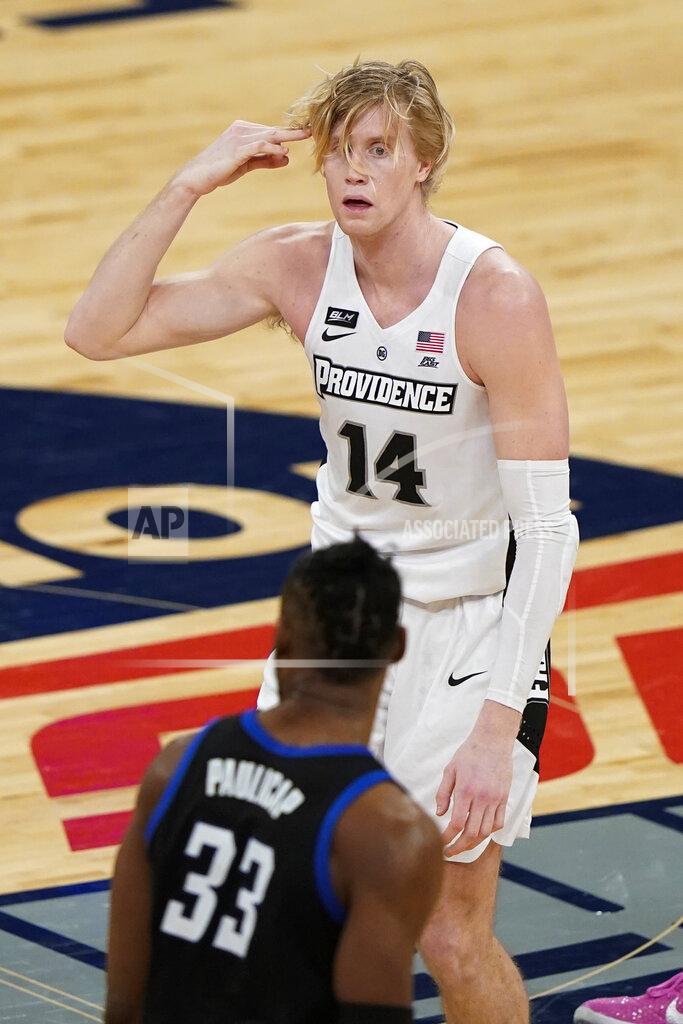 Frank Franklin Ii RETRANMISSION TO CORRECT TO SECOND HALF - Providence's Noah Horchler (14) gestures after making a three point basket during the second half of an NCAA college basketball game against DePaul in the Big East conference tournament Wednesday, March 10, 2021, in New York. (AP Photo/Frank Franklin II)