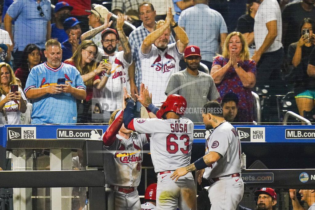 Frank Franklin Ii Fans watch as St. Louis Cardinals' Edmundo Sosa (63) celebrates with teammates after scoring on a two-run single by Andrew Knizner during the 11th inning of the team's baseball game against the New York Mets on Tuesday, Sept. 14, 2021, in New York. (AP Photo/Frank Franklin II)
