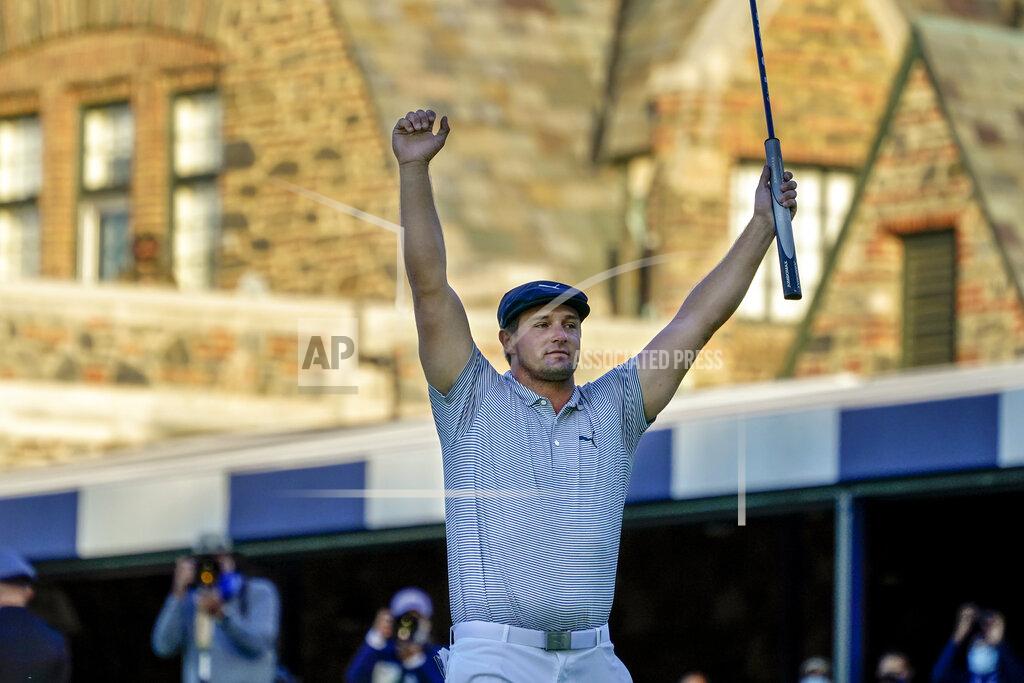 FILE - In this Sunday, Sept. 20, 2020, file photo, Bryson DeChambeau, of the United States, reacts after sinking a putt for par on the 18th hole to win the U.S. Open golf tournament in Mamaroneck, N.Y. DeChambeau's first major validated his work at getting bigger and stronger. He is the favorite going into the Masters. (AP Photo/Charles Krupa, File)