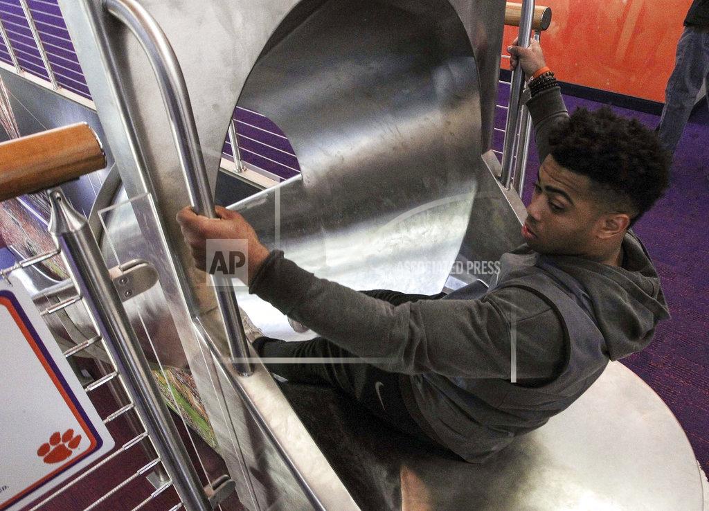 Ken Ruinard In this 2017 photo Clemson running back Darien Rencher goes down a slide inside the Clemson Football Facility at Clemson University in Clemson, S.C. When it comes to facilities in the ACC, Clemson has set the standard. The Tigers opened a $55 million team headquarters two years ago that includes a miniature golf course, a slide and a nap room. With the team pursuing its fourth straight ACC title and College Football Playoff berth, they feel the investment is paying off. (Ken Ruinard/The Independent-Mail via AP)