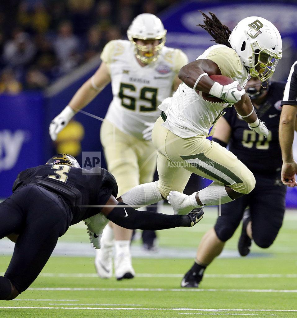 Michael Wyke Vanderbilt defensive back Tae Daley (3) trips up Baylor running back JaMycal Hasty, right, during the second half of the Texas Bowl NCAA college football game, Thursday, Dec. 27, 2018, in Houston. (AP Photo/Michael Wyke)