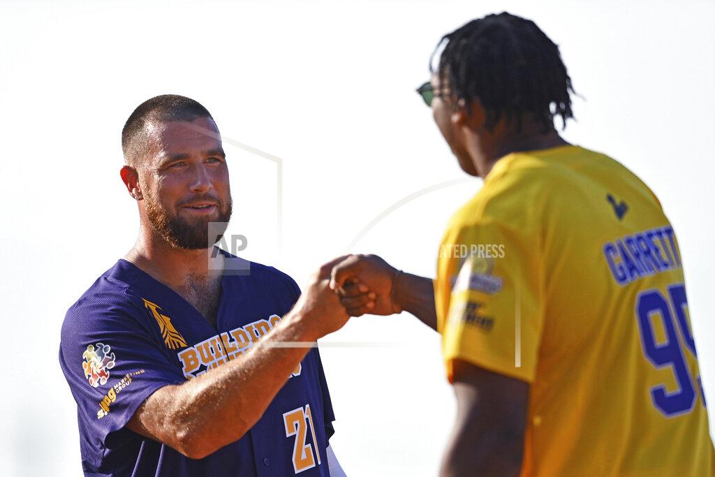 David Dermer Kansas City Chiefs tight end Travis Kelce, left, fist-bumps Cleveland Browns defensive end Myles Garrett during the Jarvis Landry Celebrity Softball game Saturday, June 12, 2021, in Eastlake, Ohio. (AP Photo/David Dermer)