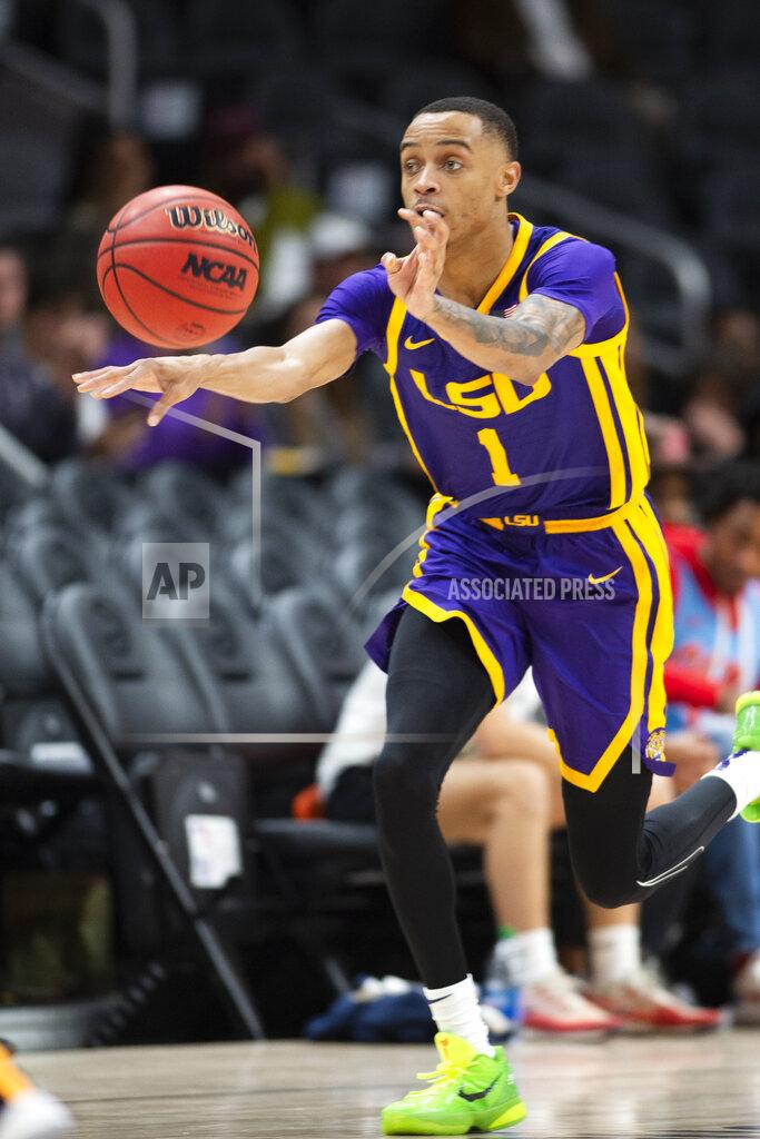 Hakim Wright Sr. LSU guard Xavier Pinson passes the ball during the second half of the team's NCAA college basketball game against Georgia Tech on Saturday, Dec. 11, 2021, in Atlanta. (AP Photo/Hakim Wright Sr.)