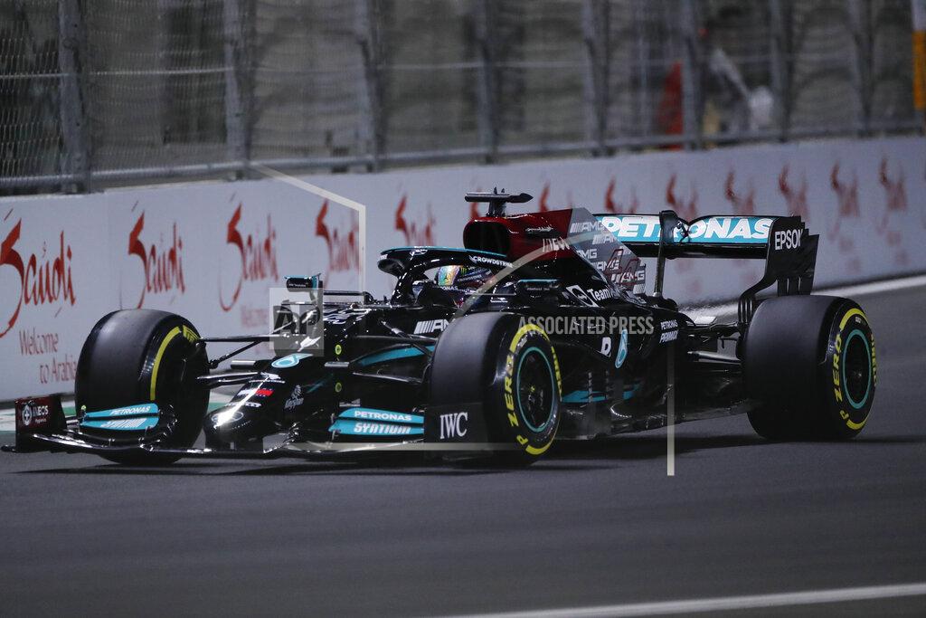 Amr Nabil Mercedes driver Lewis Hamilton of Britain In action during practice session for the Saudi Arabian Grand Prix in Jiddah, Friday, Dec. 3, 2021. (AP Photo/Amr Nabil)