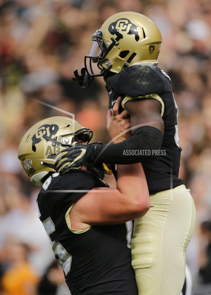 Jack Dempsey Colorado wide receiver K.D. Nixon (3) celebrates a touchdown with offensive lineman Colby Pursell (65) during the first half of an NCAA college football game against Oregon State, Saturday, Oct. 27, 2018, in Boulder, Colo. (AP Photo/Jack Dempsey)