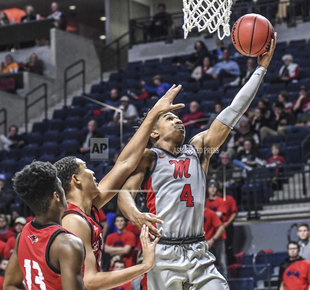 Bruce Newman Mississippi guard Breein Tyree (4) scores against Seattle guard Morgan Means, left, and forward Myles Carter during an NCAA college basketball game Tuesday, Nov. 19, 2019, in Oxford, Miss. (Bruce Newman/The Oxford Eagle via AP)