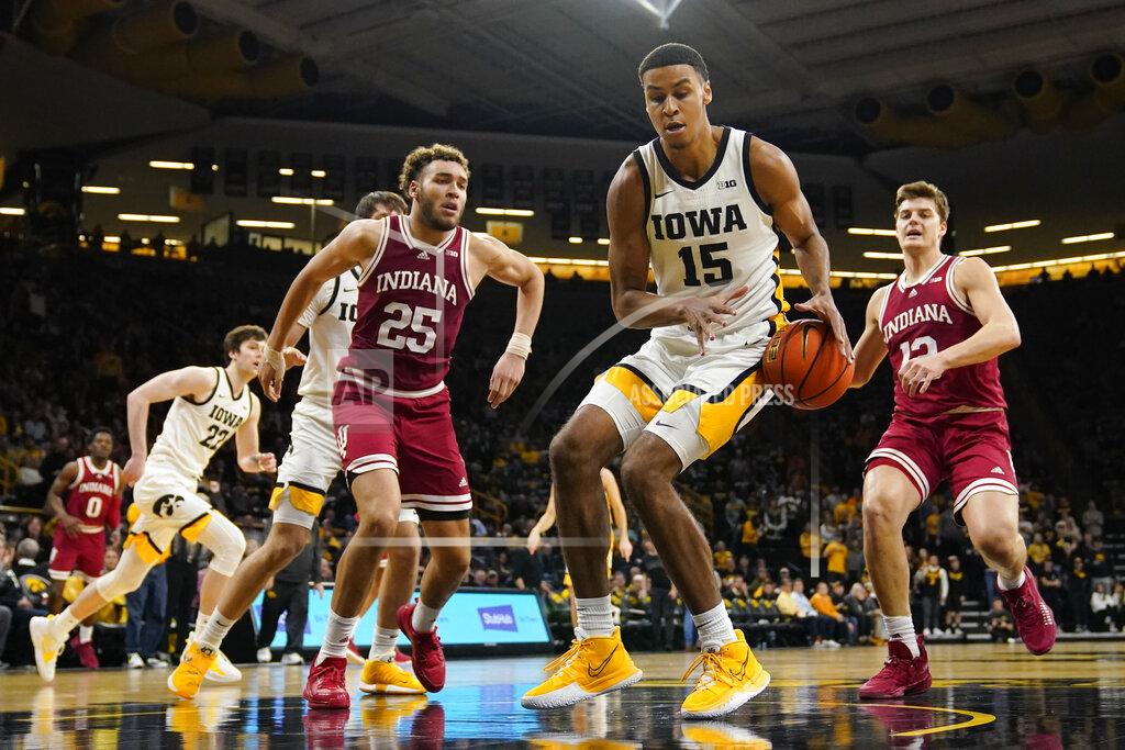 Charlie Neibergall Iowa forward Keegan Murray (15) loses control of the ball between Indiana forward Race Thompson (25) and forward Miller Kopp (12) during the second half of an NCAA college basketball game, Thursday, Jan. 13, 2022, in Iowa City, Iowa. (AP Photo/Charlie Neibergall)