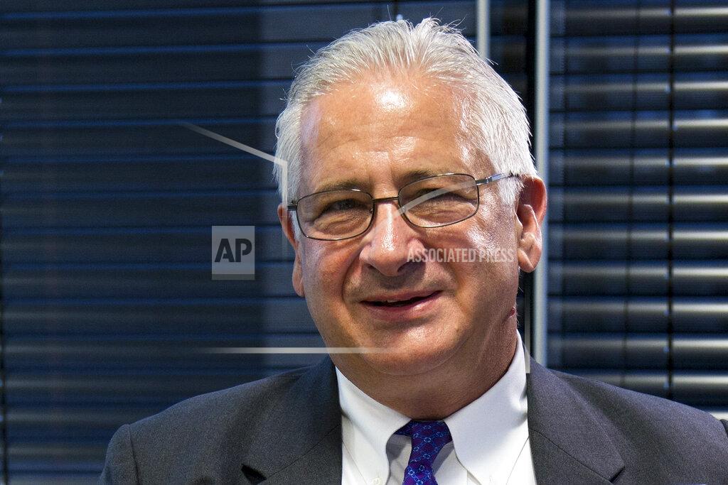 Alexander Zemlianichenko FILE - In this file photo taken on Monday, Oct. 23, 2017, Alexis Rodzianko, the president of the American Chamber of Commerce in Russia, smiles during an interview with The Associated Press. "This is an ongoing, what they call a visa war. Well now the visa war has been expanded to the general population," said Alexis Rodzianko. (AP Photo/Alexander Zemlianichenko, File)