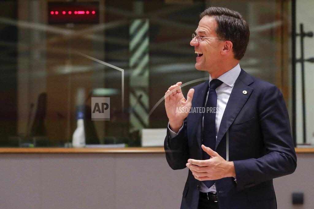 Stephanie Lecocq Dutch Prime Minister Mark Rutte smiles during a round table meeting at an EU summit in Brussels, Tuesday, July 21, 2020. Weary European Union leaders are expressing cautious optimism that a deal is in sight as they moved into their fifth day of wrangling over an unprecedented budget and coronavirus recovery fund. (Stephanie Lecocq, Pool Photo via AP)