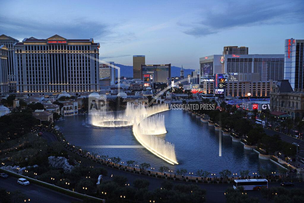 FILE - In this April 4, 2017, file photo, the fountains of Bellagio erupt along the Las Vegas Strip in Las Vegas. The NFL on Tuesday, Jan. 21, 2020, detailed its draft plans for April 23-25 on the city's glittering Strip. The league knows it has a long ways to go to match the previous road shows, particularly in Philadelphia and Nashville. It believes it has found the right place in the Nevada desert. (AP Photo/John Locher, File)