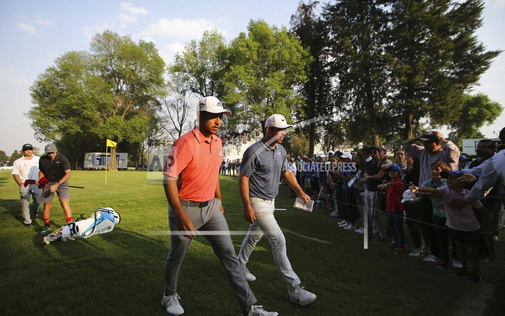 Fernando Llano Xander Schauffele of the United States, left, and Paul Casey of England, leave the 18th green during the second round for the WGC-Mexico Championship golf tournament, at the Chapultepec Golf Club in Mexico City, Friday, Feb. 21, 2020.(AP Photo/Fernando Llano)