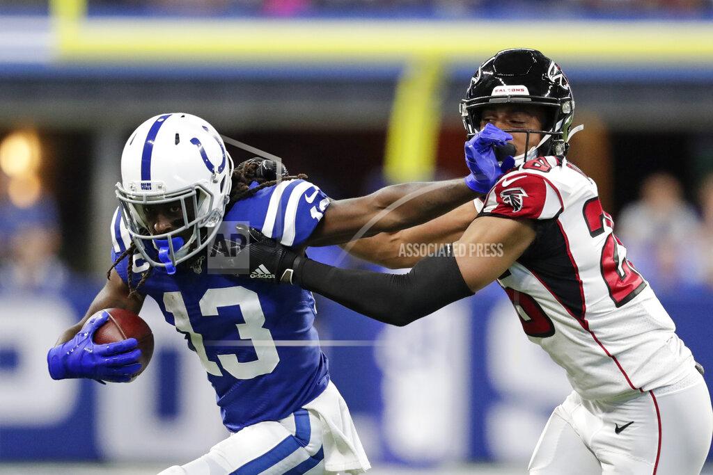 Michael Conroy Indianapolis Colts wide receiver T.Y. Hilton (13) is tackled by Atlanta Falcons cornerback Isaiah Oliver (26) during the first half of an NFL football game, Sunday, Sept. 22, 2019, in Indianapolis. (AP Photo/Michael Conroy)