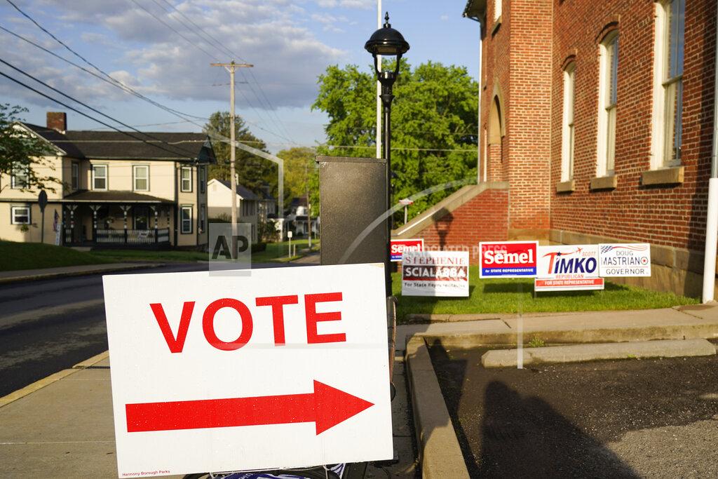 Keith Srakocic Signs point the way for voters to cast their ballots at the polling location for the Pennsylvania primary election, Tuesday, May 17, 2022, in Harmony, Pa., (AP Photo/Keith Srakocic)