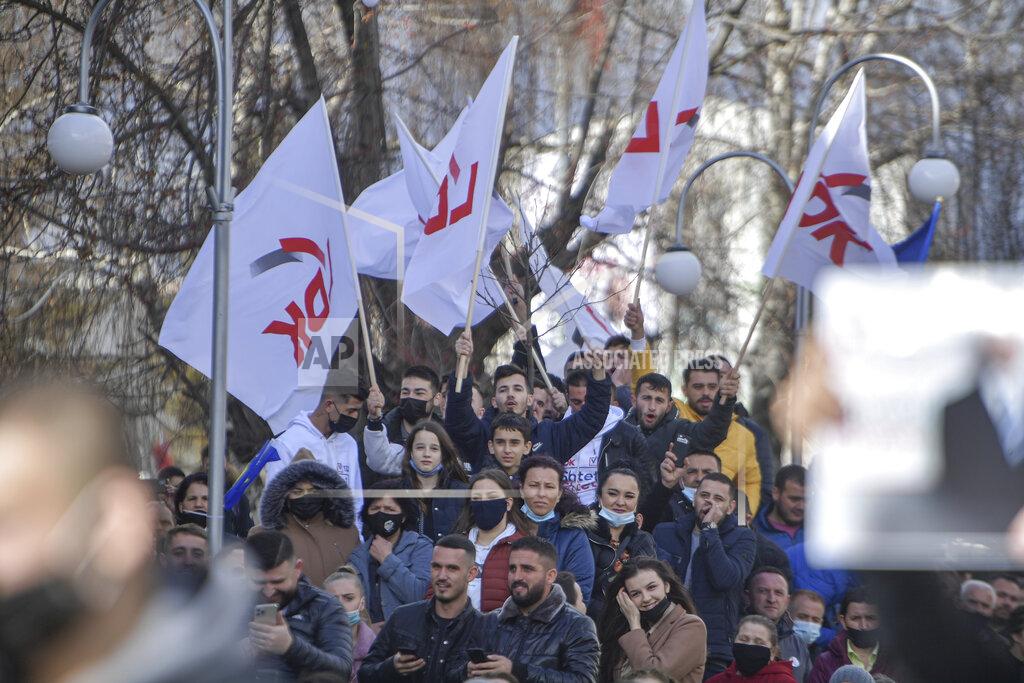 Visar Kryeziu Supporters of Kosovo Democratic League (LDK) participate in a pre-electoral gathering in Viti, Kosovo, photo taken on Wednesday, Feb. 10, 2021. Kosovo holds an early general election on upcoming Sunday Feb. 14, amid the coronavirus pandemic, economic downturn and stalled negotiations with wartime foe Serbia.(AP Photo/Visar Kryeziu)