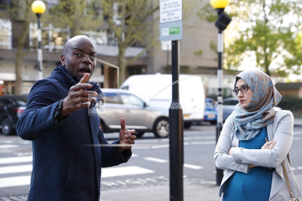 Alastair Grant The Conservative party candidate for London Mayor, Shaun Bailey speaks to a local doctor Dr Yasmin Razak who complained about her surgery's state and lack of facilities in the Ladbroke Grove area of west London during a campaign stop in London, Thursday, April 29, 2021. (AP Photo/Alastair Grant)